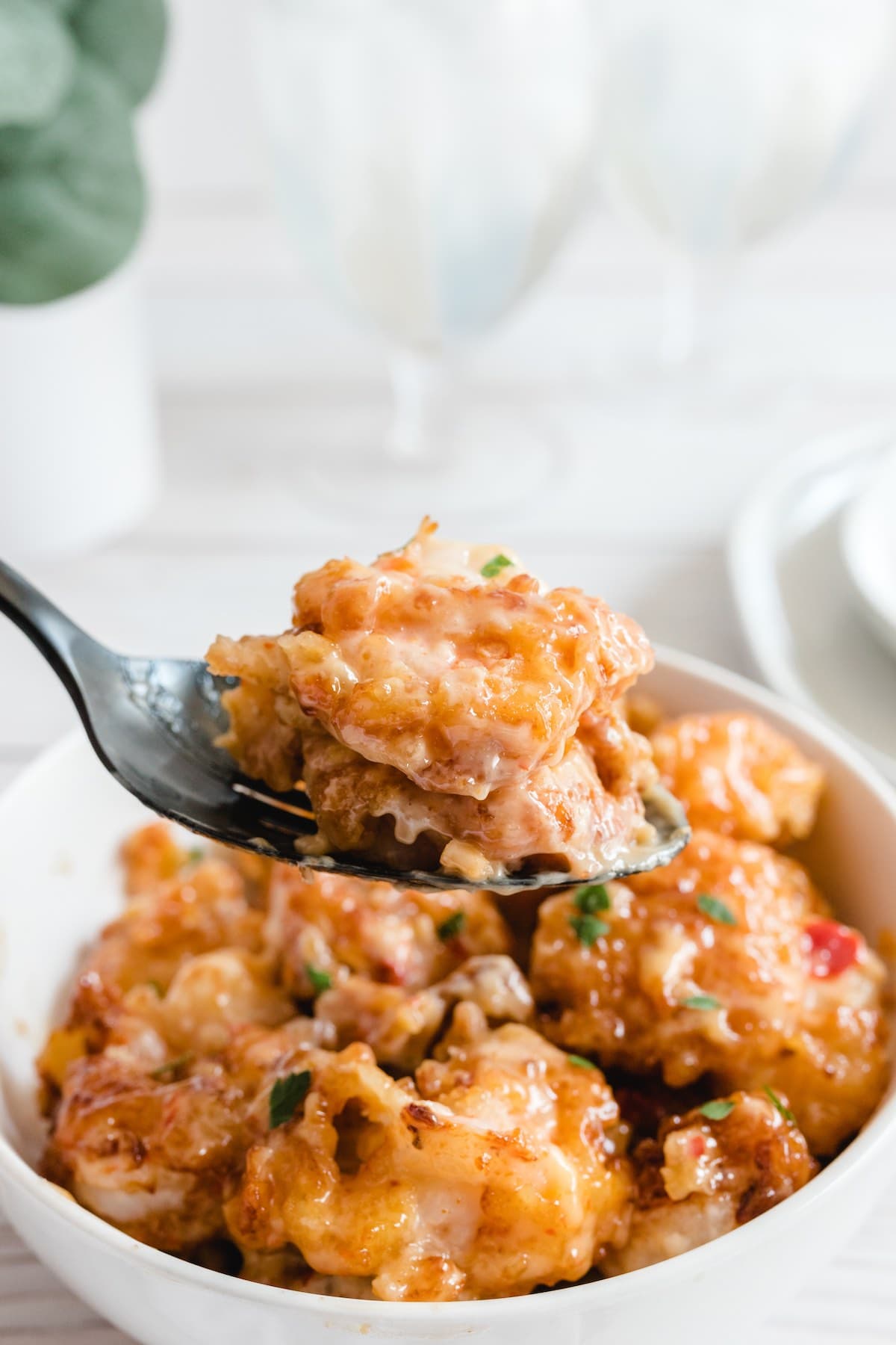 eating bang bang shrimp with a spoon. 