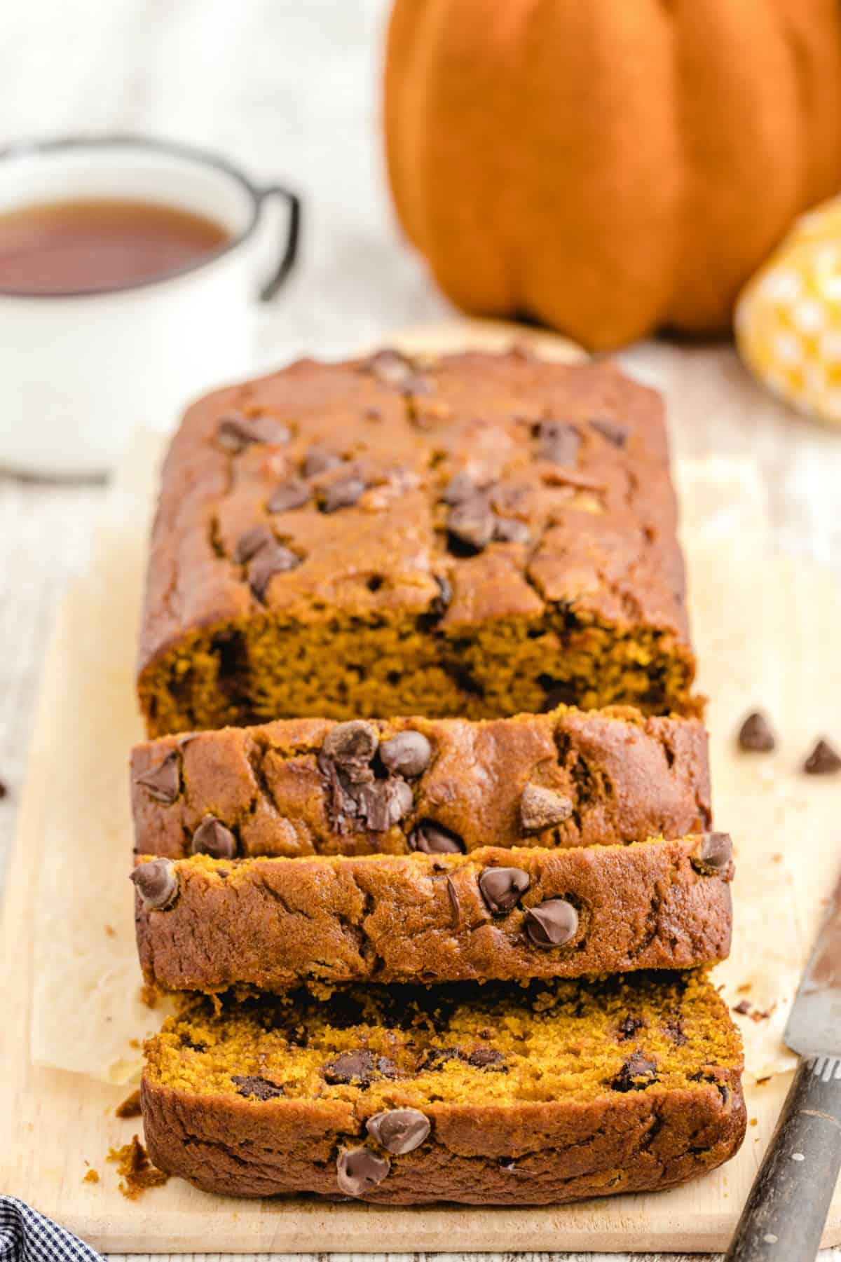 Chocolate Chip Pumpkin Bread on a cutting board sliced