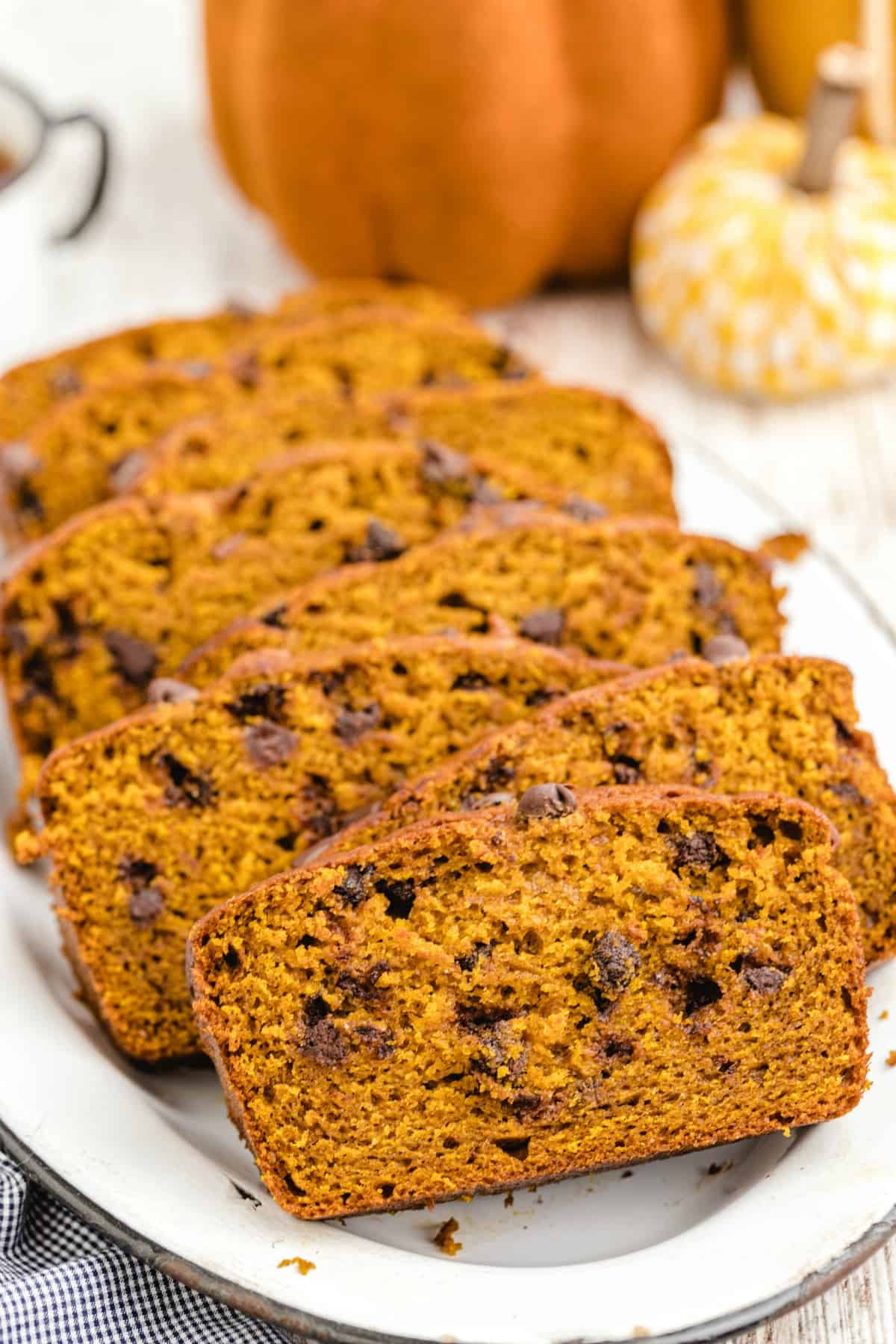 pumpkin bread sliced on a white plate