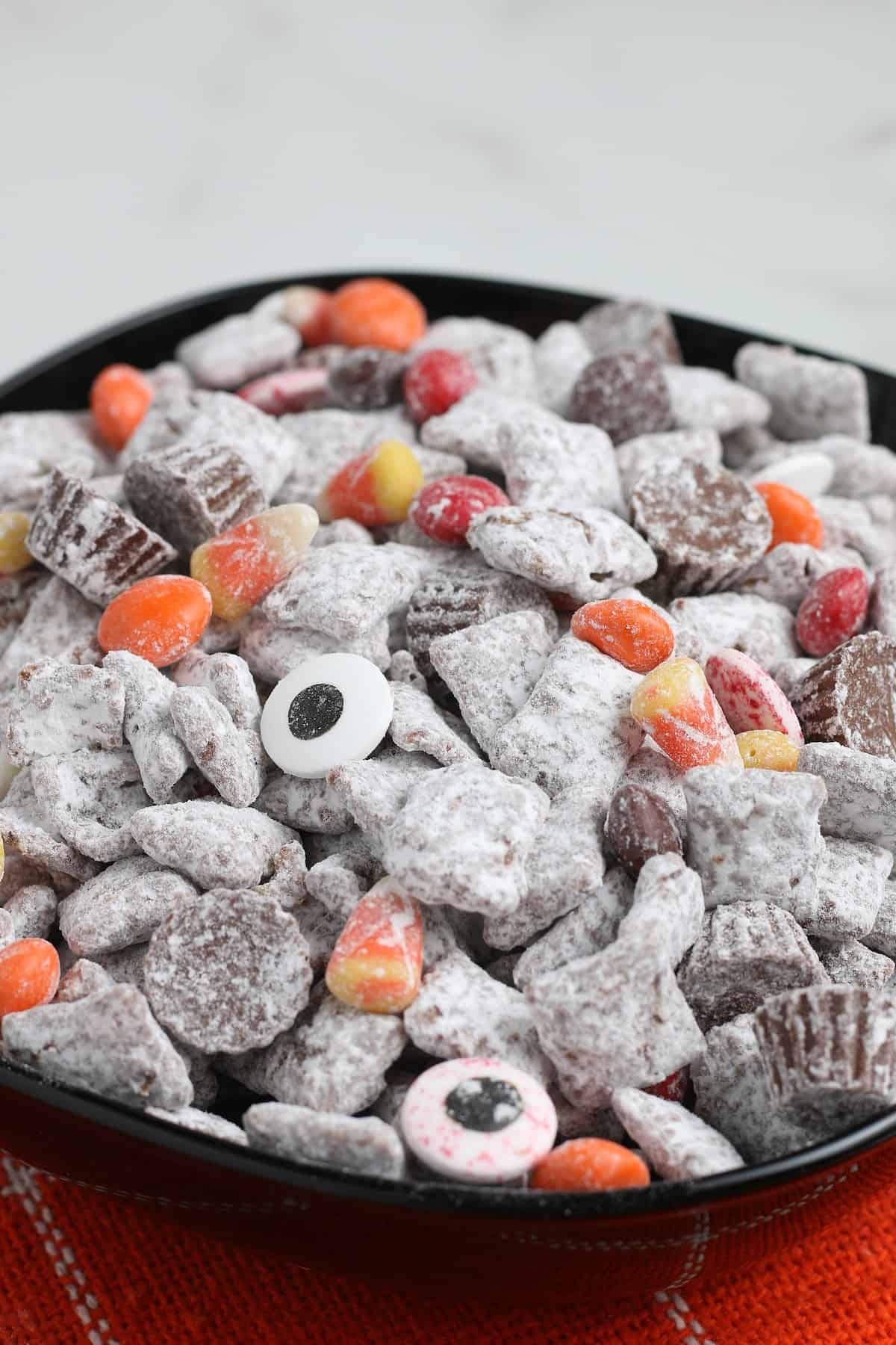 Halloween Puppy Chow in a black bowl