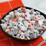 Halloween Puppy Chow in a black bowl