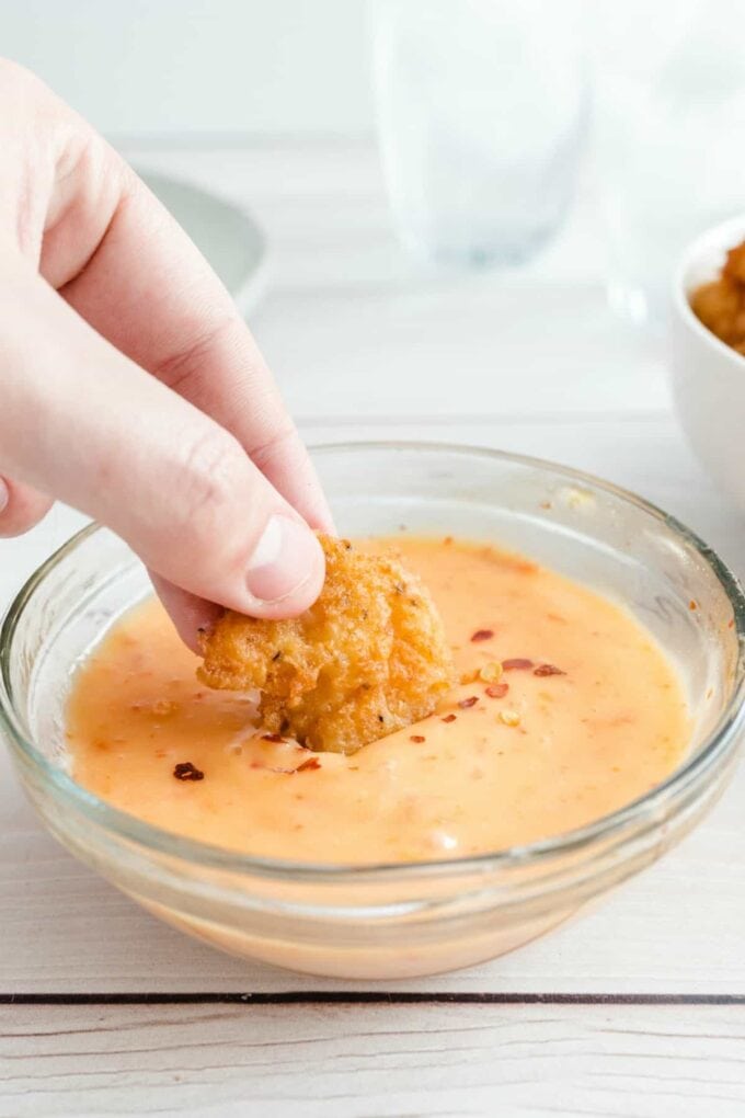 dipping shrimp in sauce