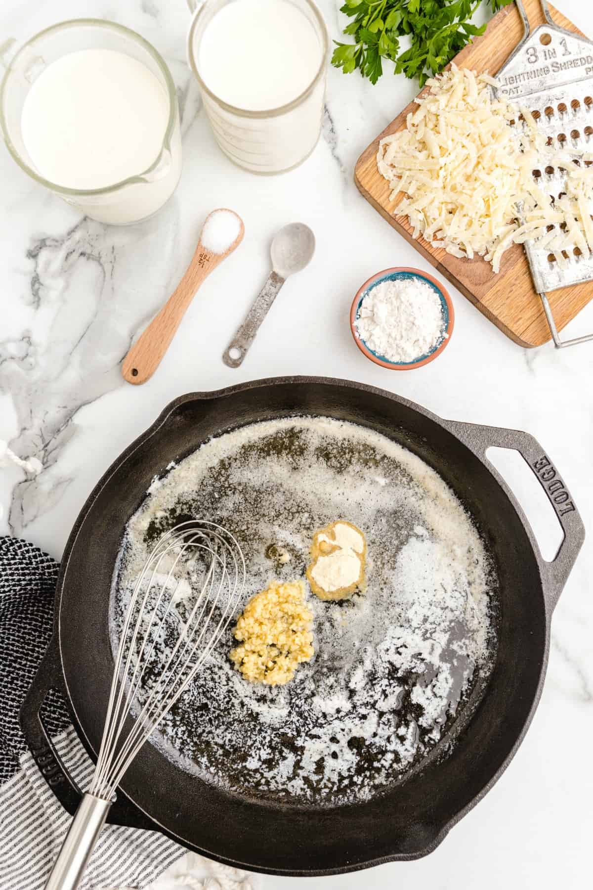 a skillet with butter and garlic