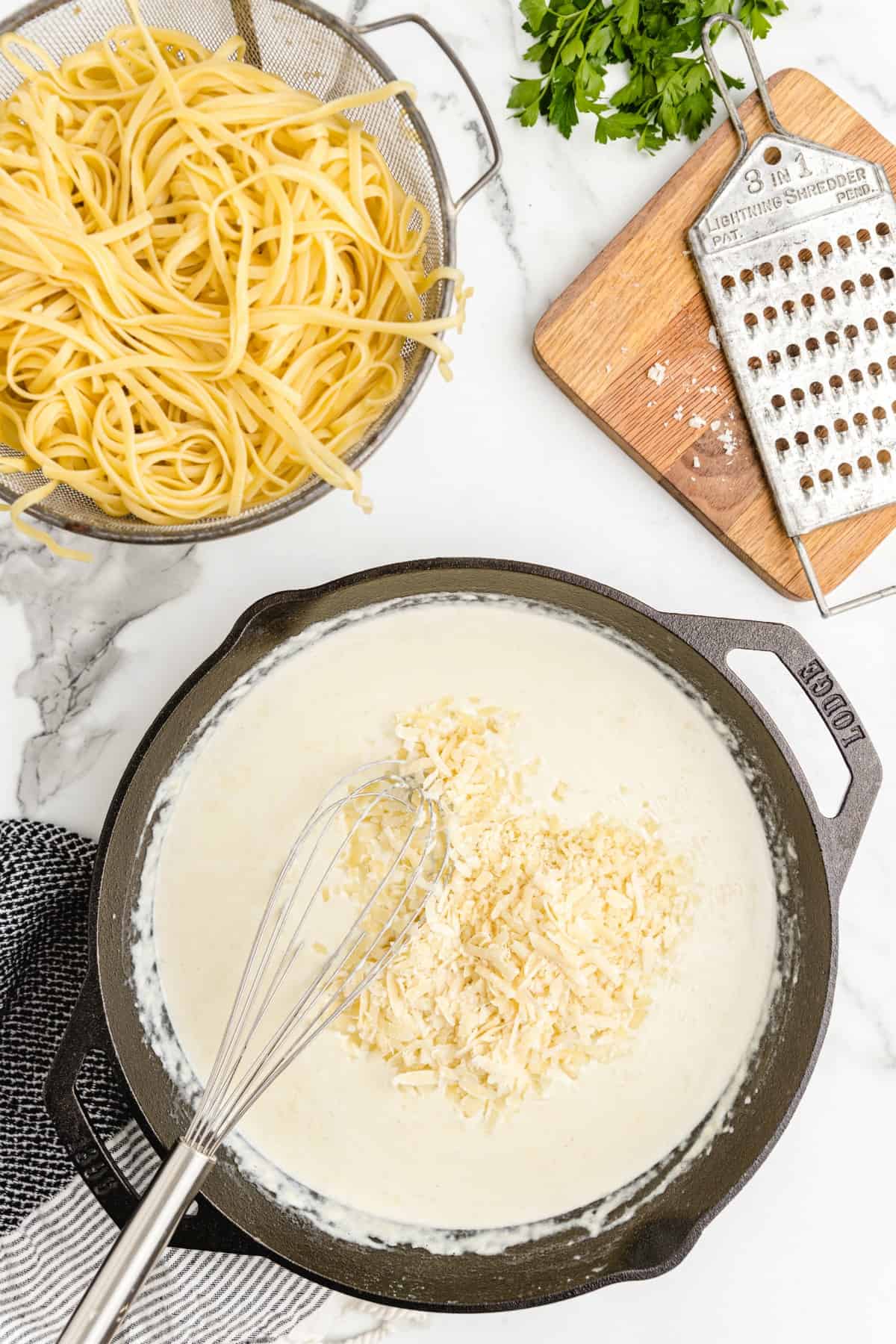 parmesan cheese whisked in sauce