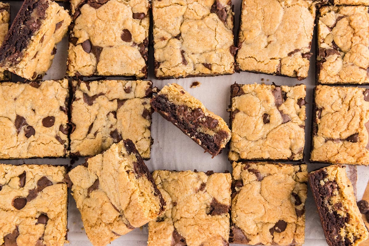 Sliced brookies, showcasing the cookie layer with chocolate chips and the rich brownie base.