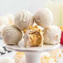 White Chocolate Peanut Butter Truffles on a cake plate