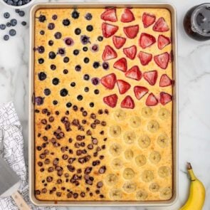 sheet pan pancake with multiple fruits.