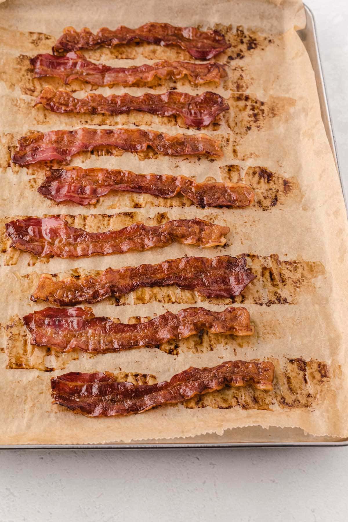 baked bacon on top of baking sheet. 