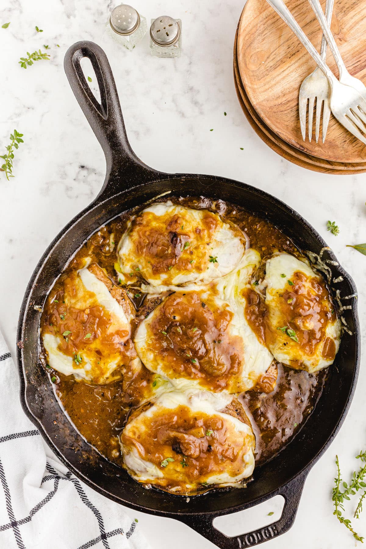 french onion pork chops in a skillet
