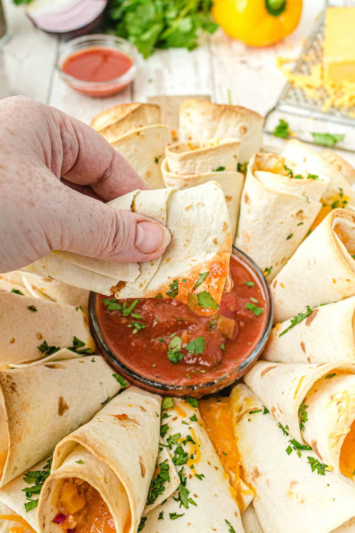 Quesadilla dipped in salsa