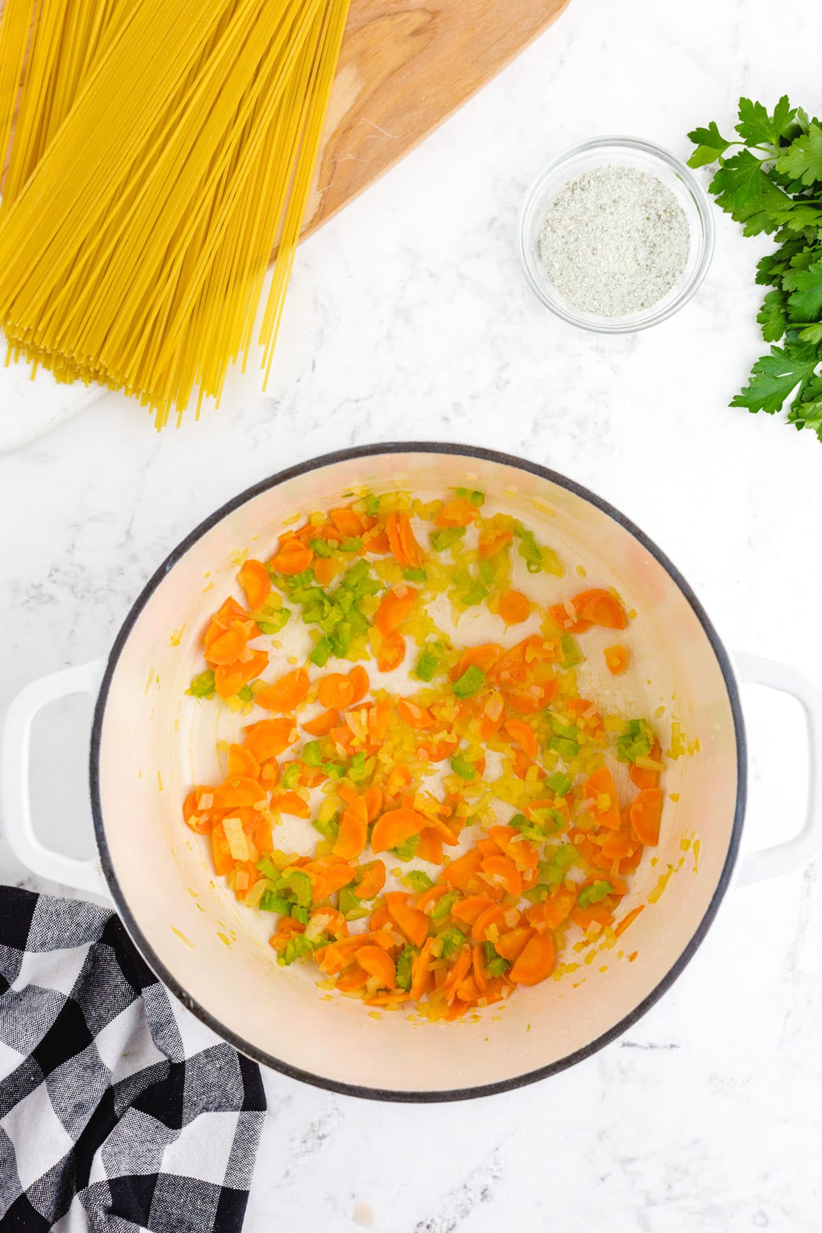 Melt butter and add diced carrots, celery, and onions in a stock pot