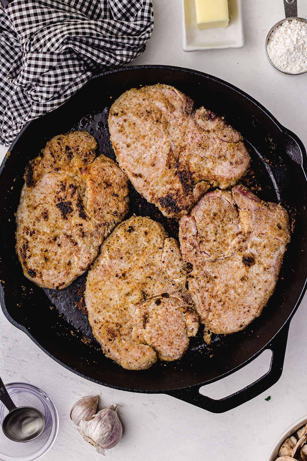 Smothered Pork Chops in the pan