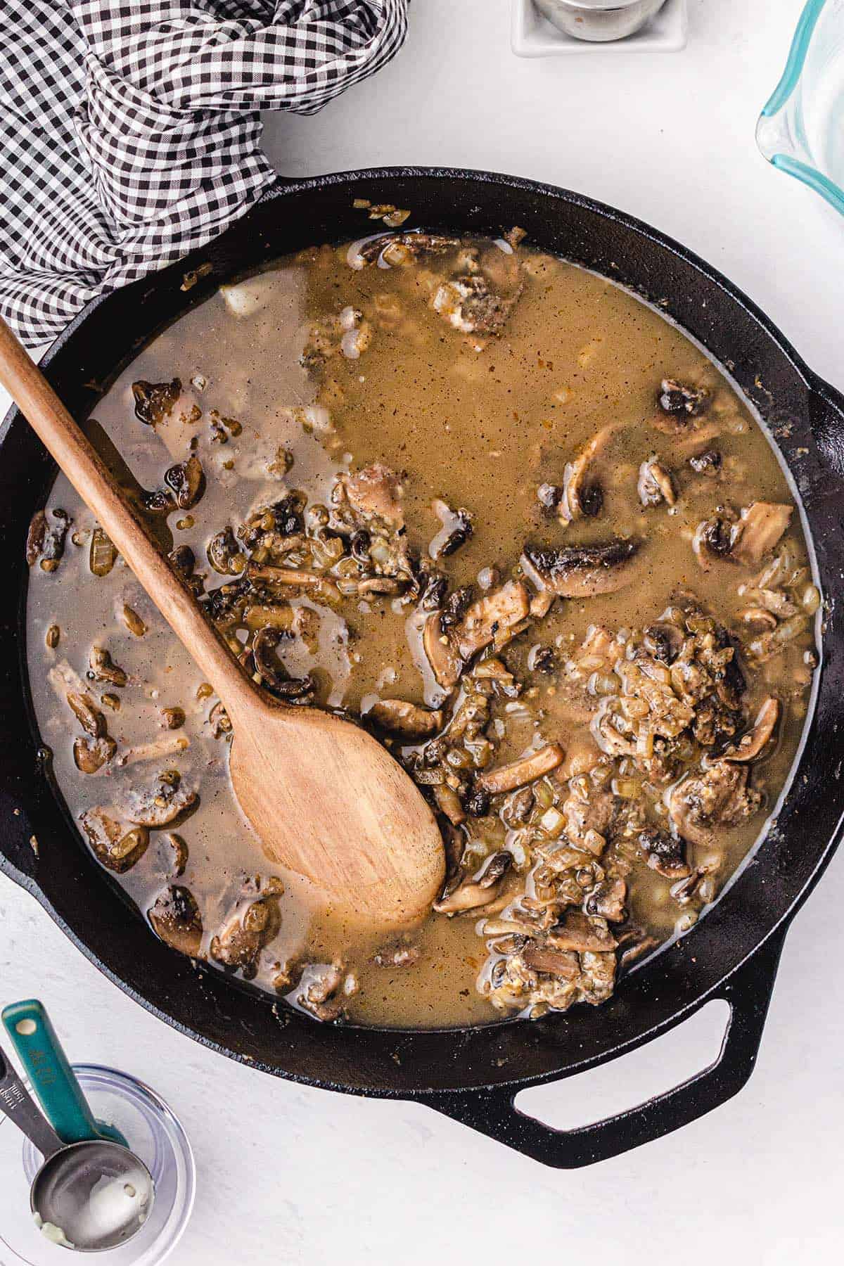 butter, minced garlic, onion, mushrooms, chicken broth mixed together in a frying pan