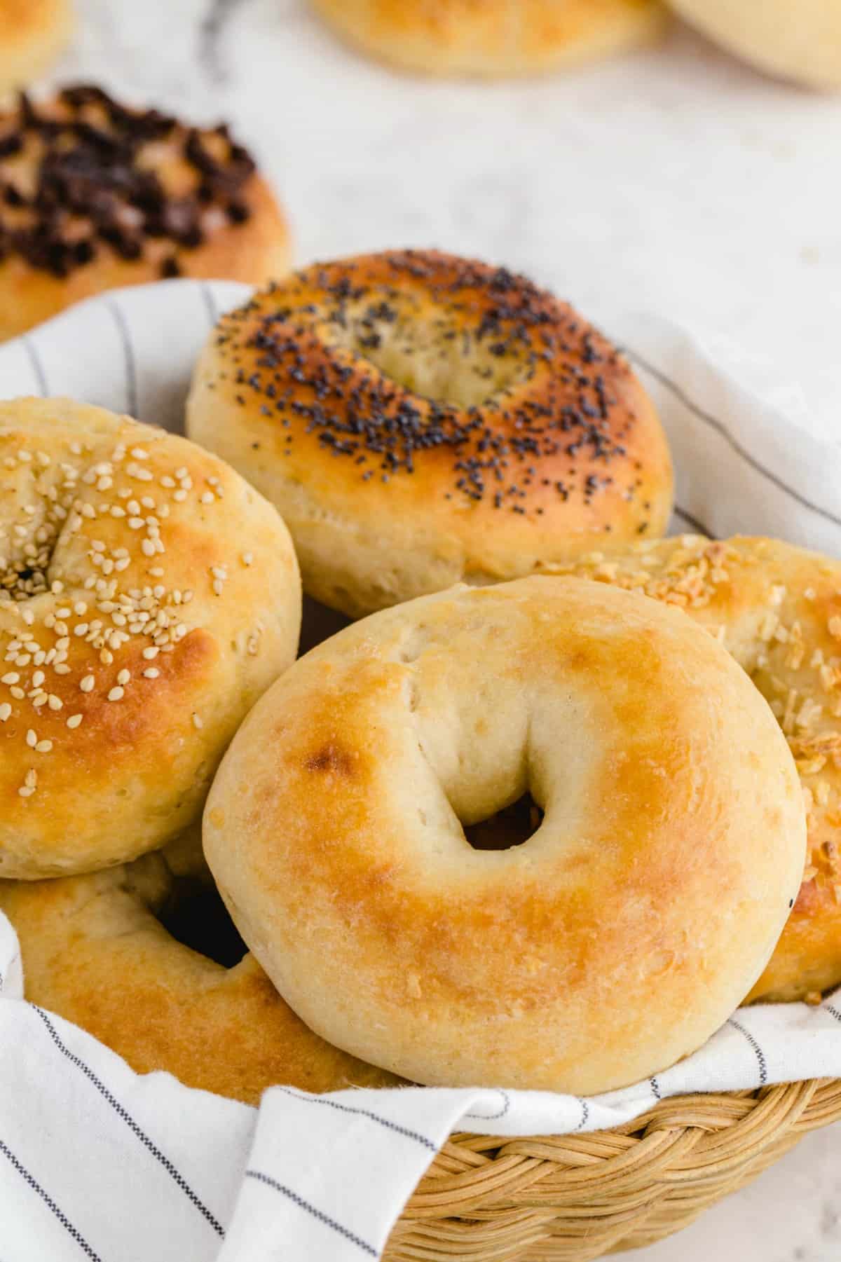 a couple of bagels in a basket. 