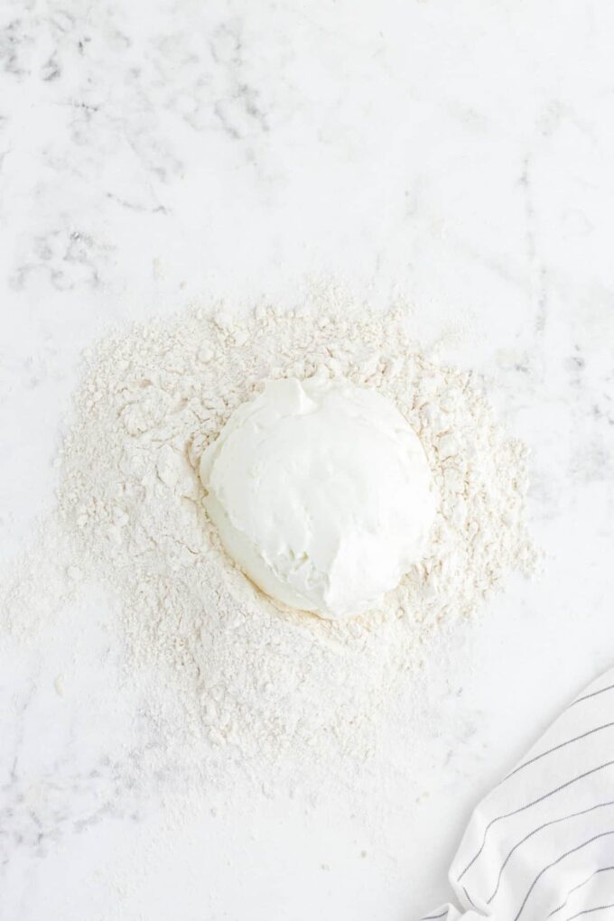 yogurt on mound of flour