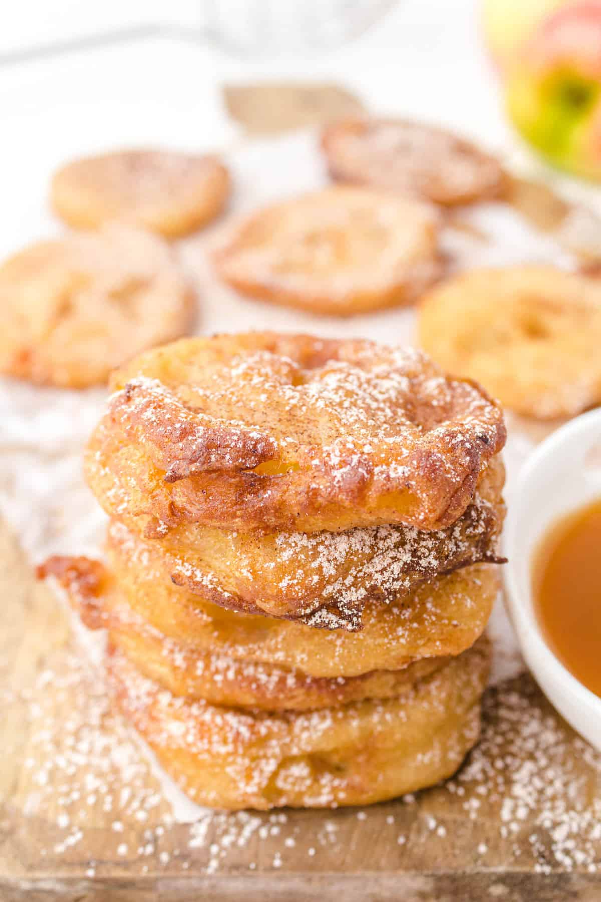 apple fritter rings on a cutting board