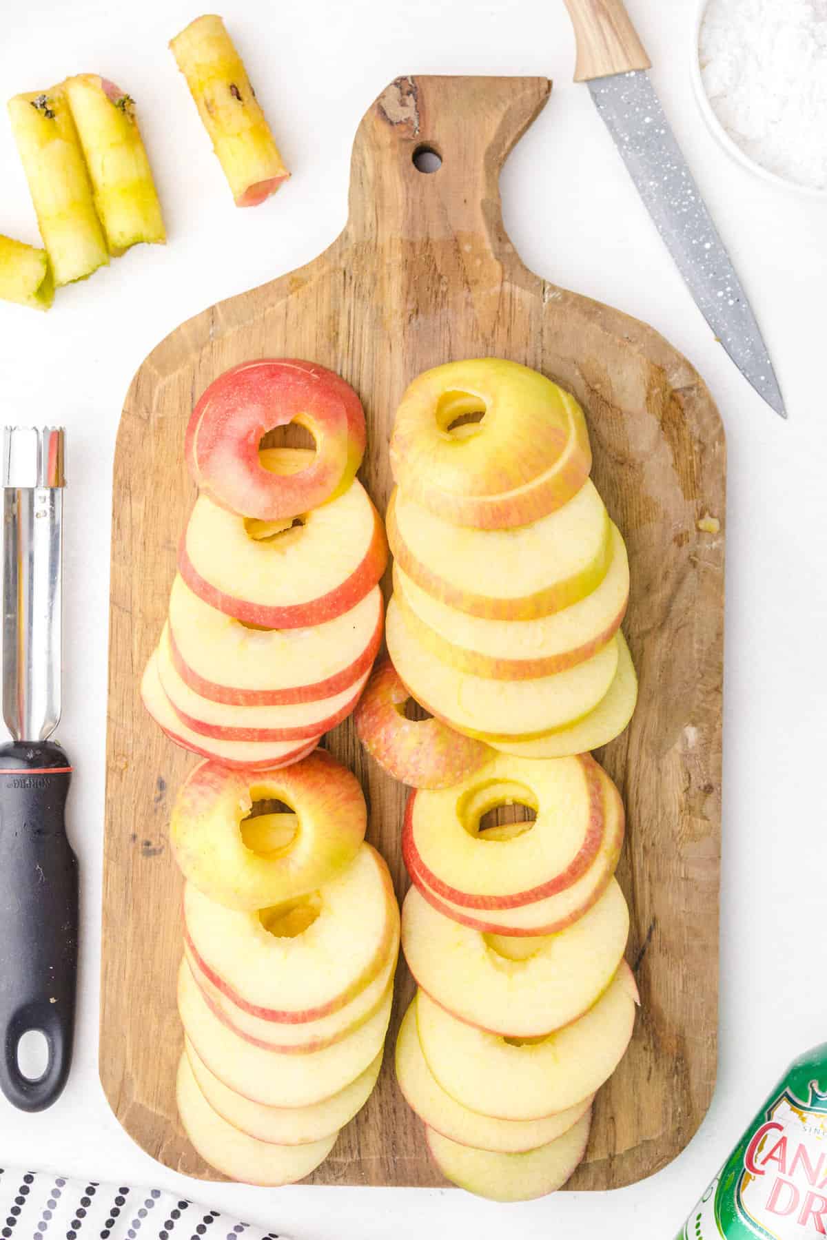 cored apples on a cutting board