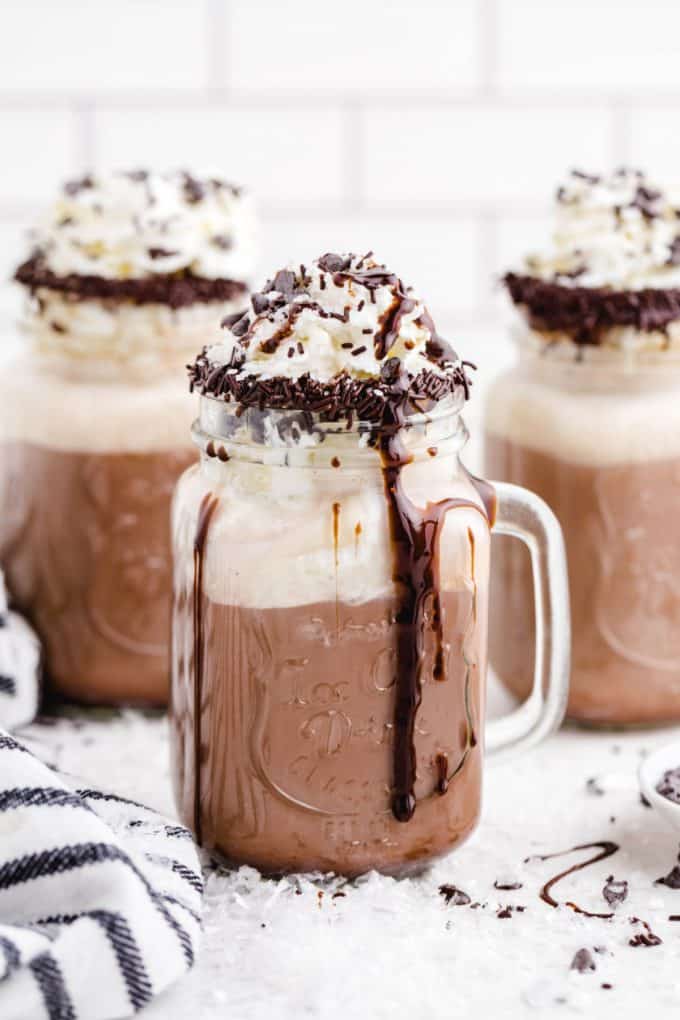  Dirty Snowman drink with chocolate syrup and whipped cream in a glass mug