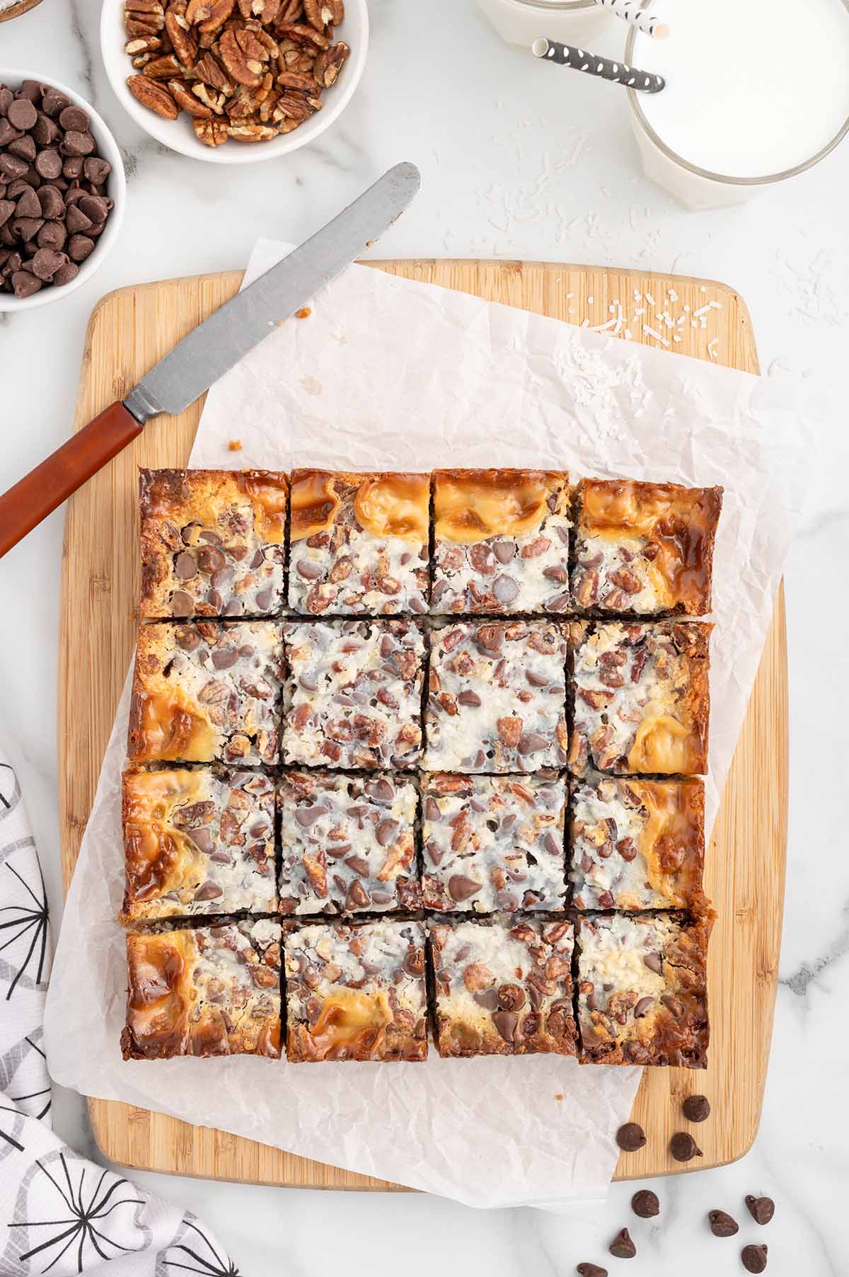 magic cookie bars in a pan cut into squares. 