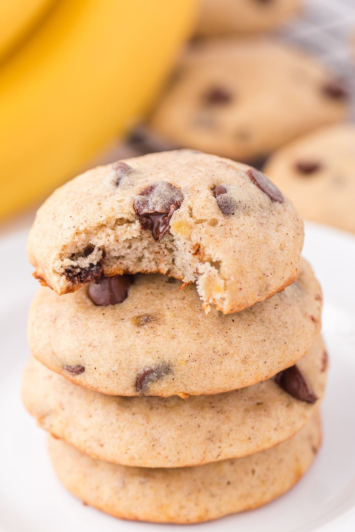 bitten banana bread cookies stacked on top of each other. 