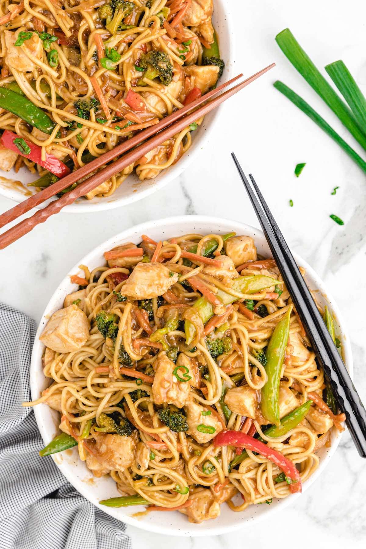 chicken lo mein served in a bowl. 