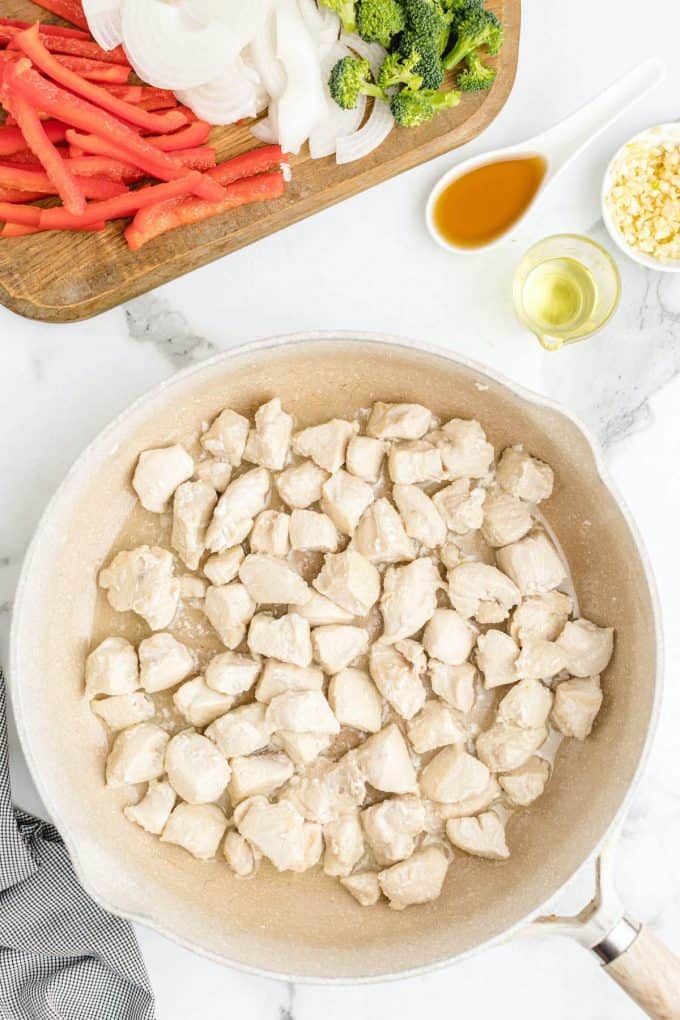 chicken cooking in a pan