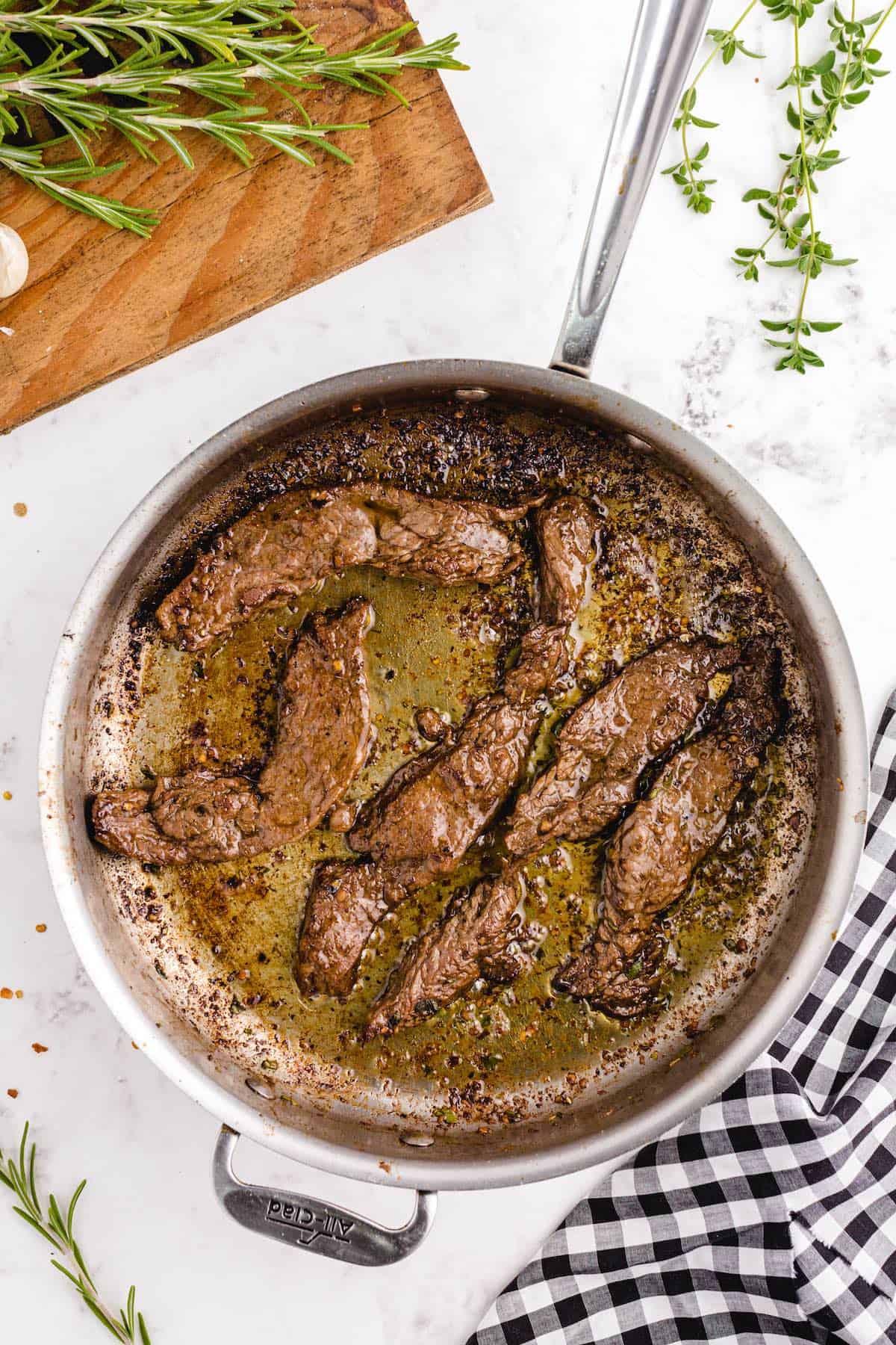 several strips of brown meat in a skillet