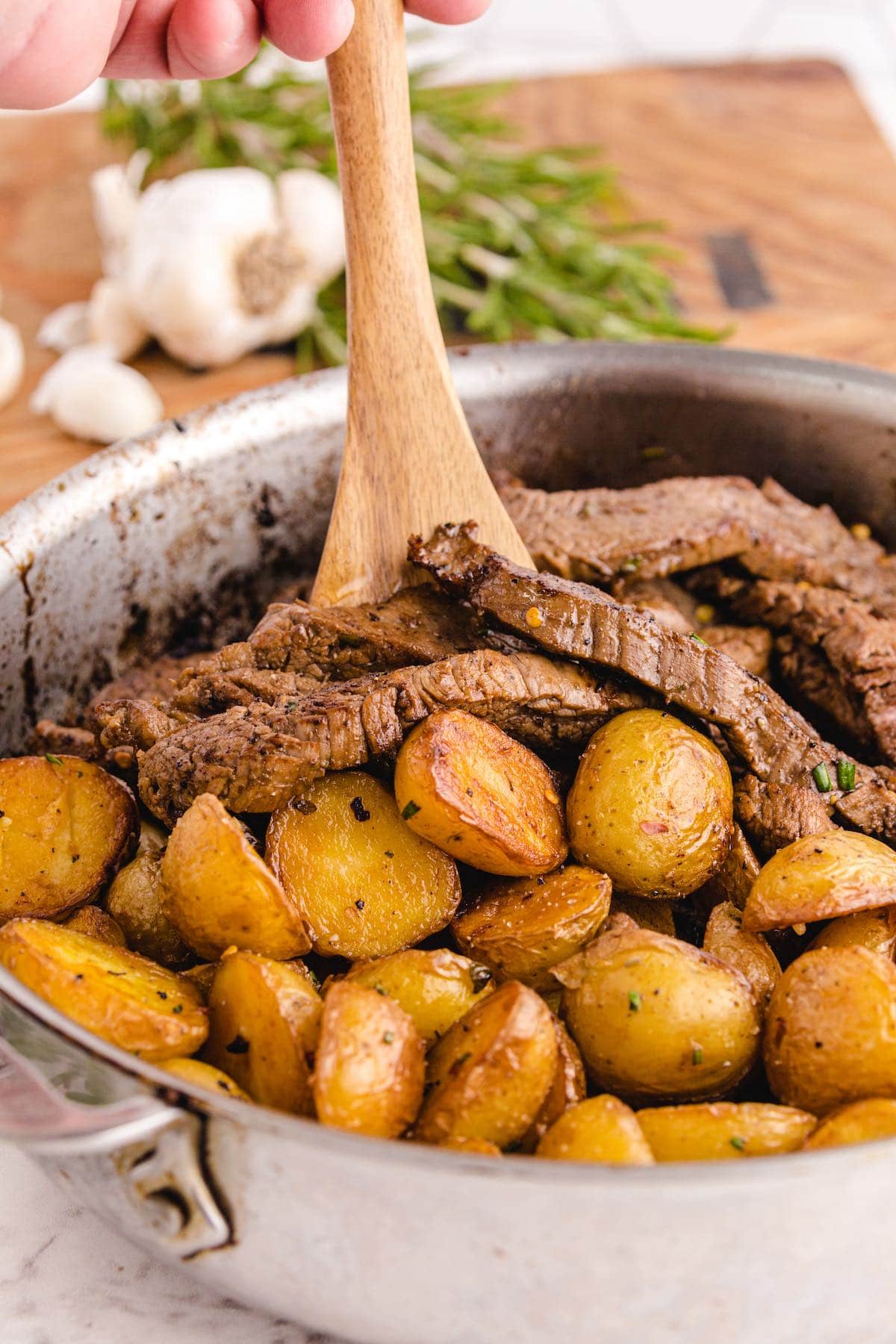 garlic butter steak and potato skillet in a pan. 