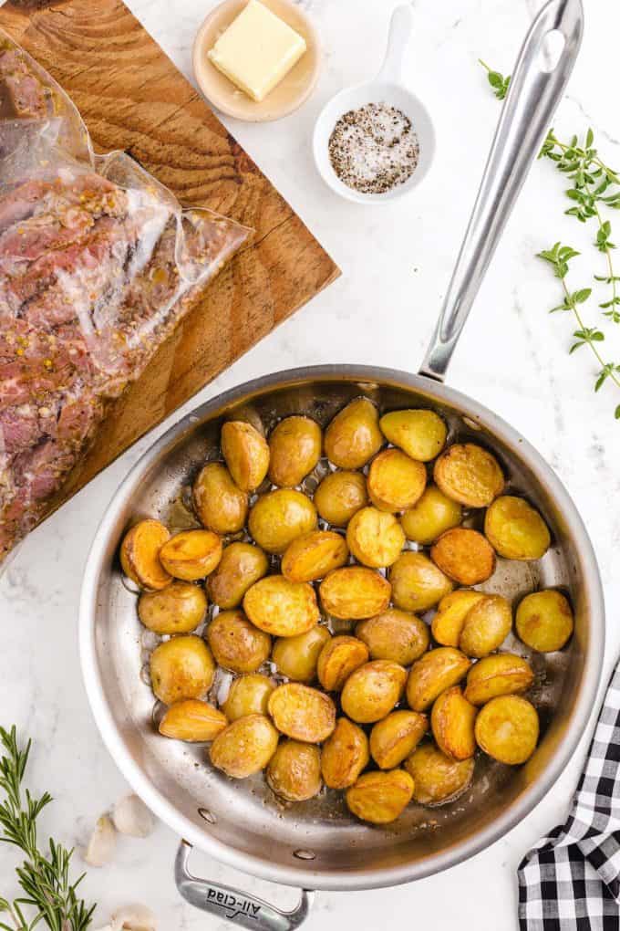 saute potatoes in a skillet