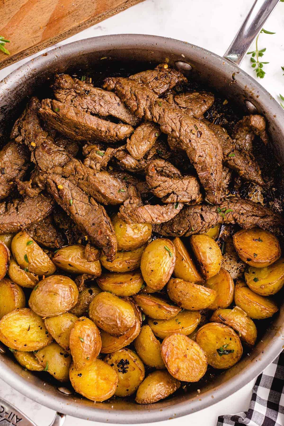 garlic butter steak and potato skillet in a pan