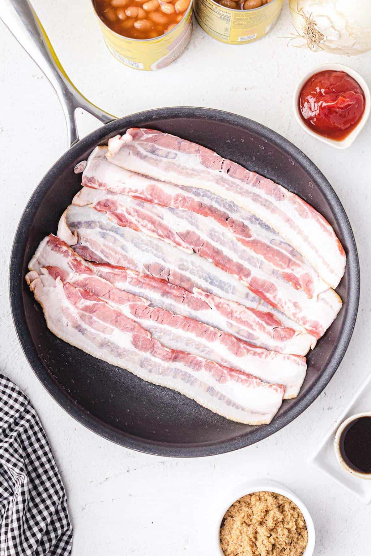 bacon strips in frying pan