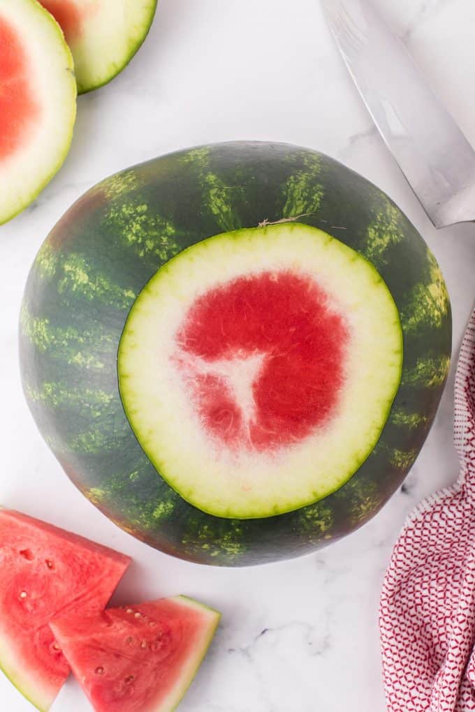 Cut off the top and bottom of the watermelon