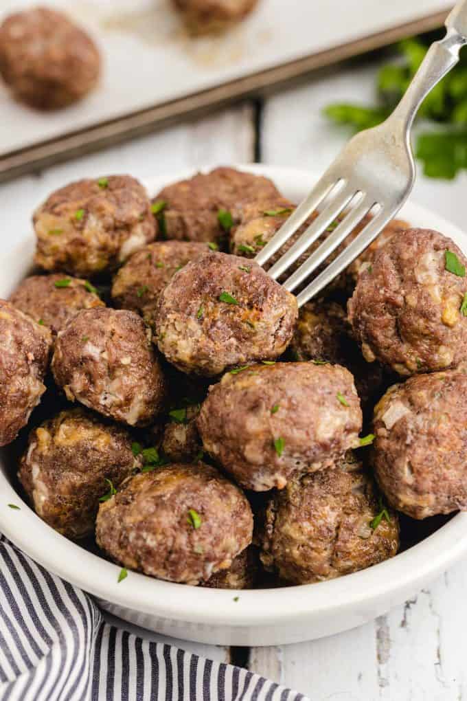 homemade meatballs in a bowl with fork