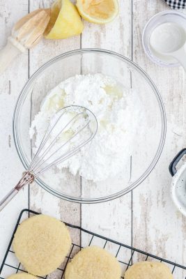 Mix together confectioner’s sugar, lemon juice, and cream