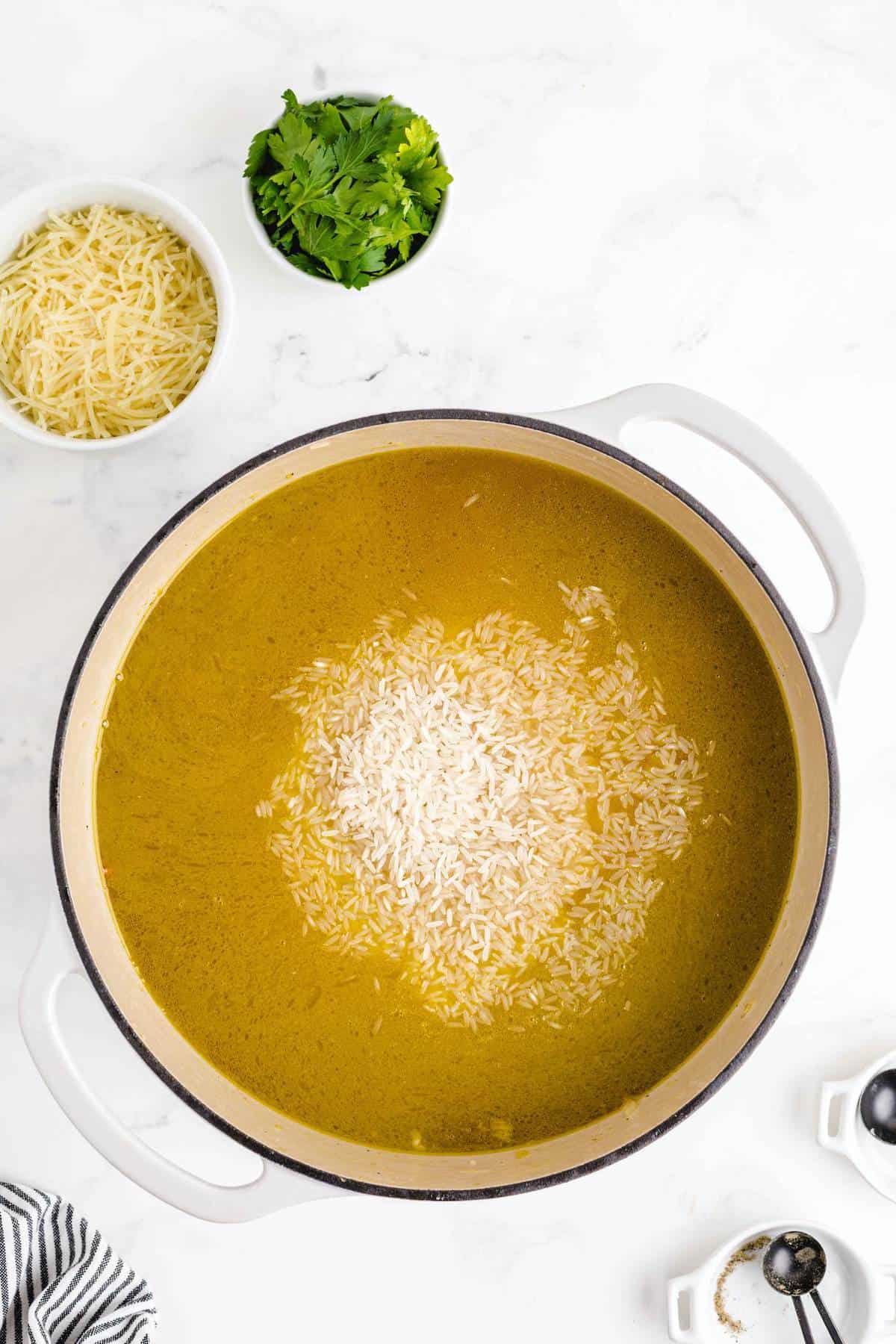 adding rice into the pot