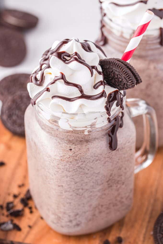 oreo milkshake topped with whipped cream and chocolate syrup