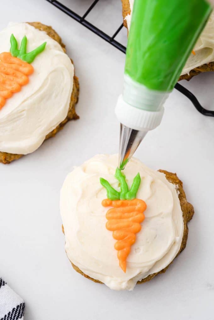 decorating each cookie with carrot