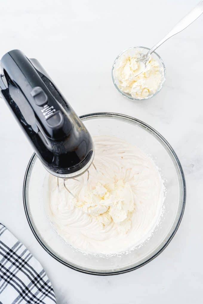 adding mascarpone cheese to the mixture