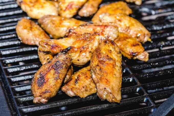 grilled chicken wings on top of the grill