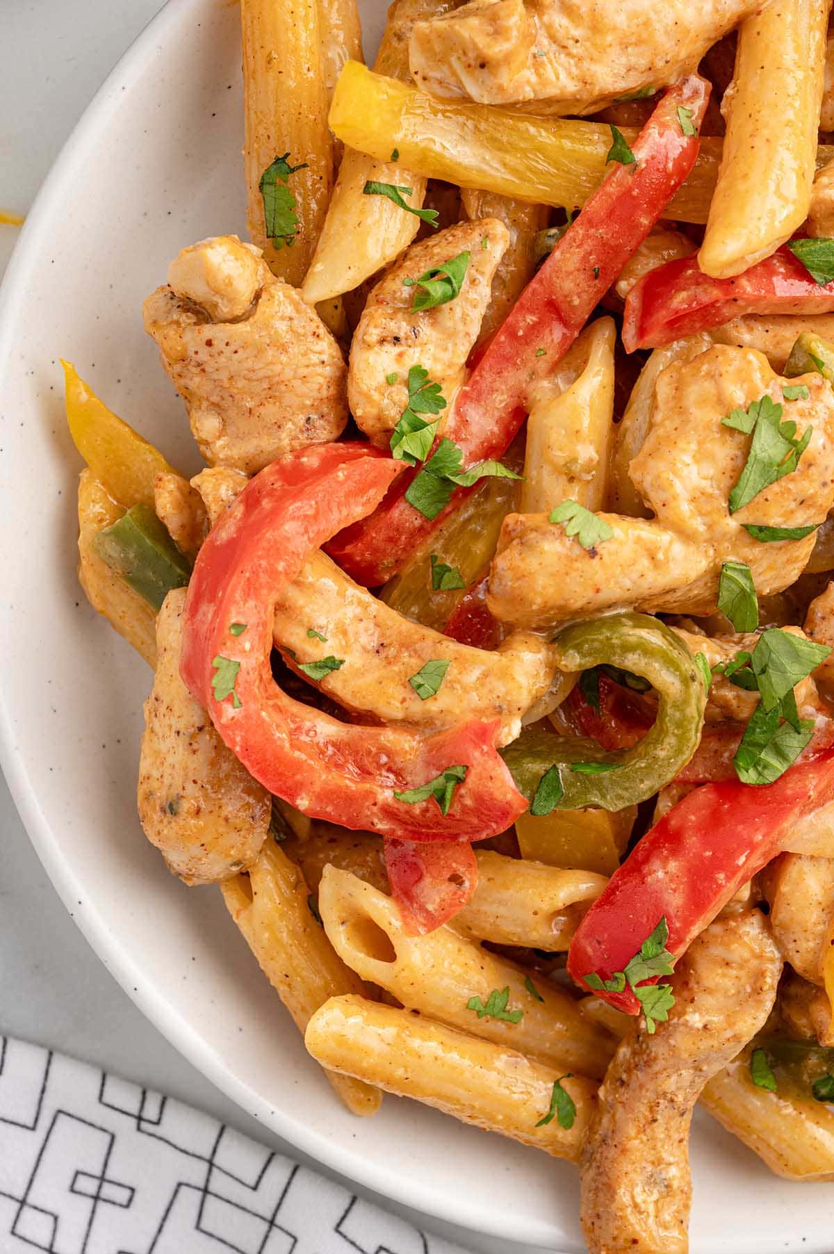 Chicken Fajita Pasta in a white plate.