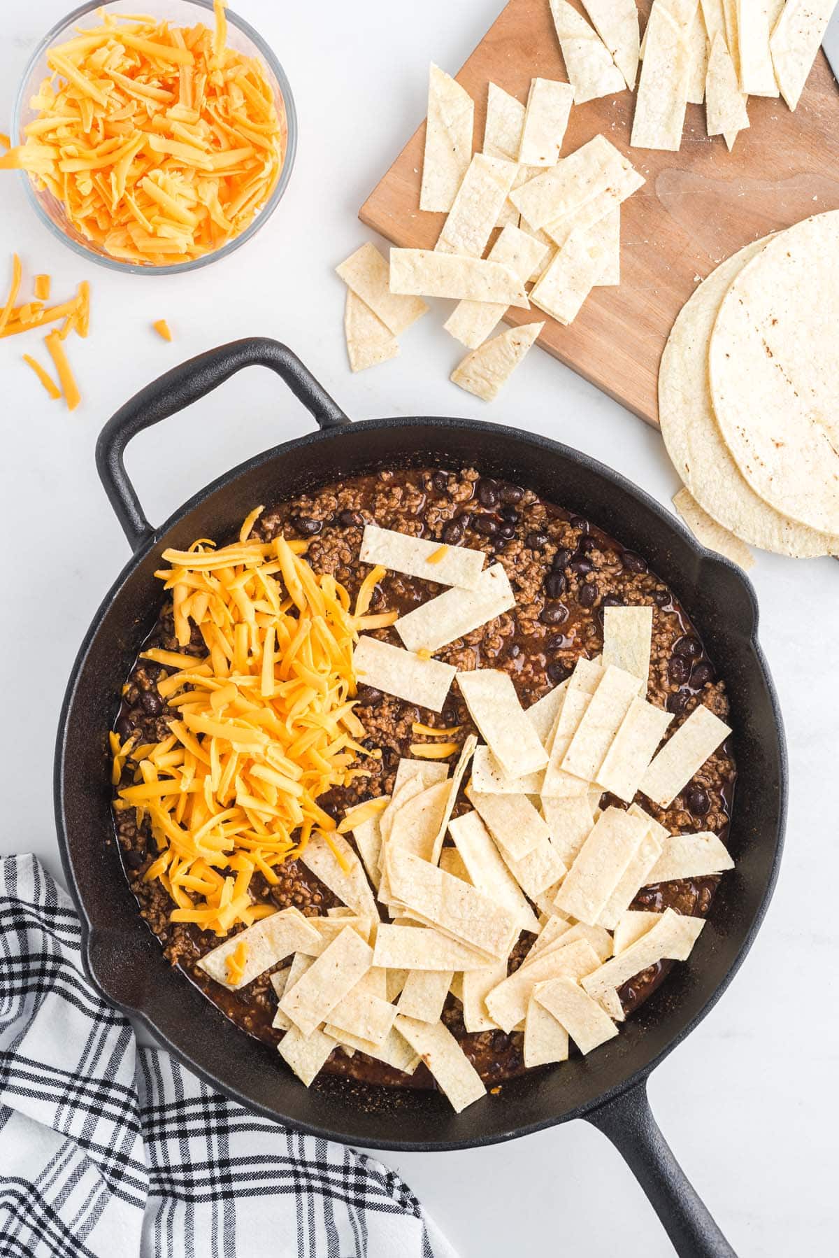 add cheese and tortillas in the skillet