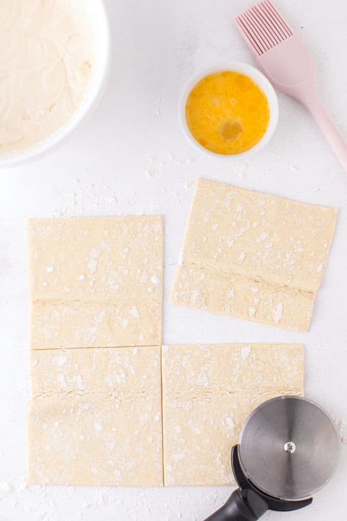 unfold the puff pastry into four equal squares