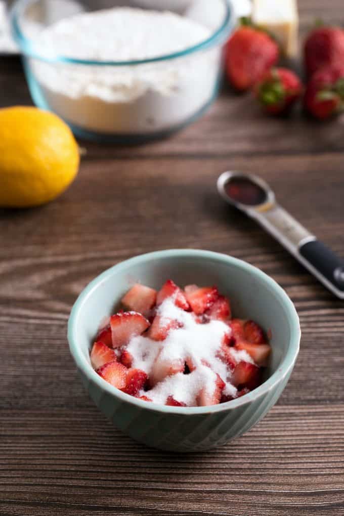 Mix strawberries, lemon juice, and granulated sugar in a small bowl
