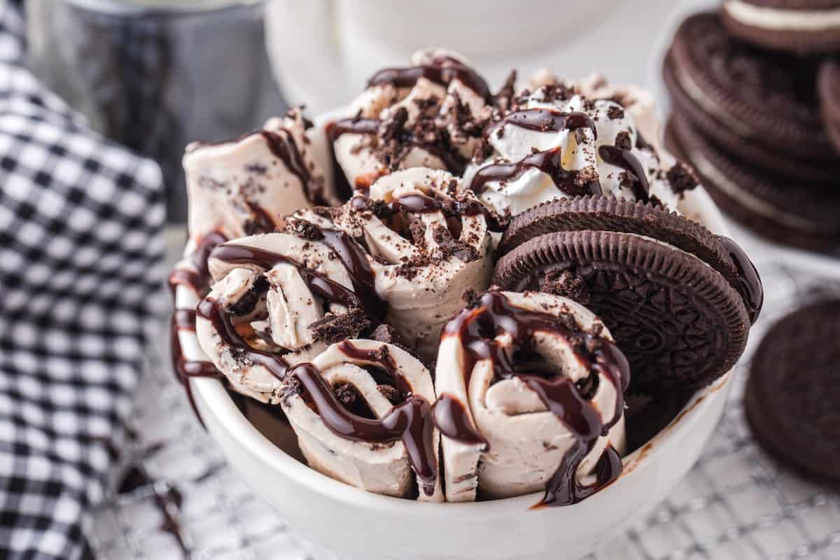 oreo rolled ice cream in a bowl with toppings