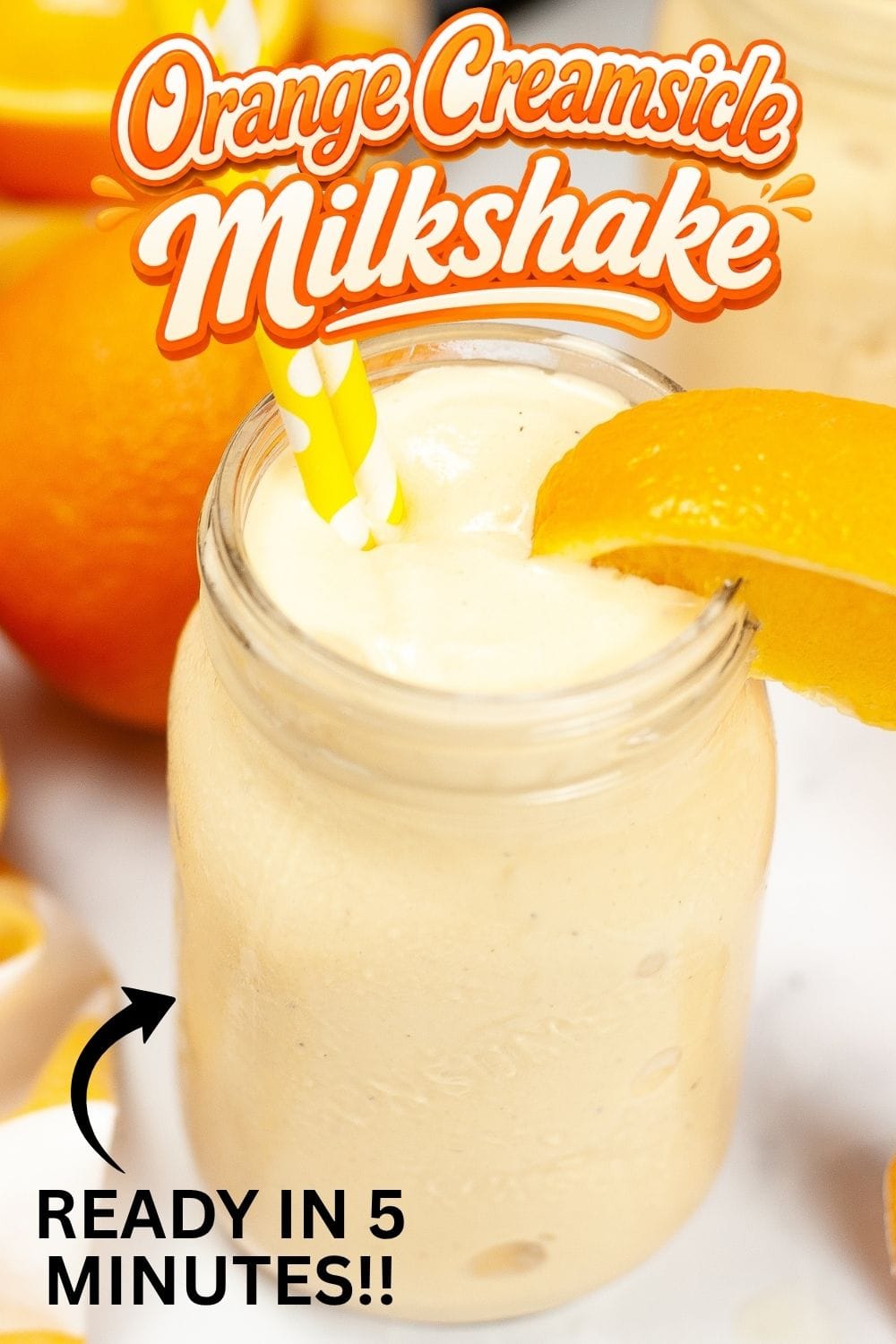 Orange Creamsicle Milkshake in a mason jar with a yellow straw and fresh orange slice, ready in 5 minutes.