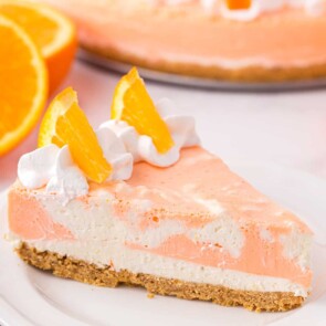 Orange Creamsicle Cheesecake on a white plate