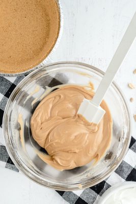 adding milk to the peanut butter mixture