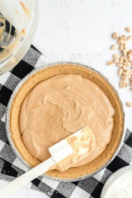 Pour the peanut butter into the crust