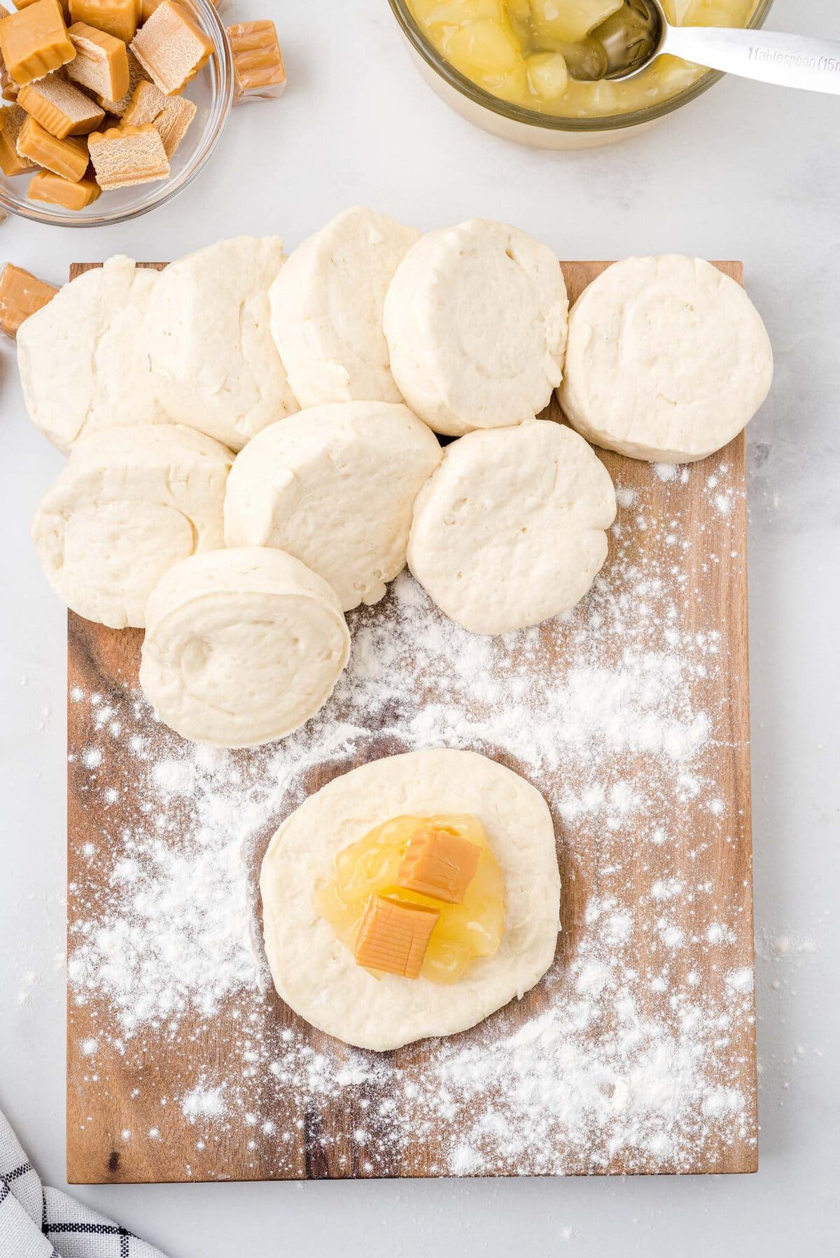 add apple pie filling and caramel on top of the dough.