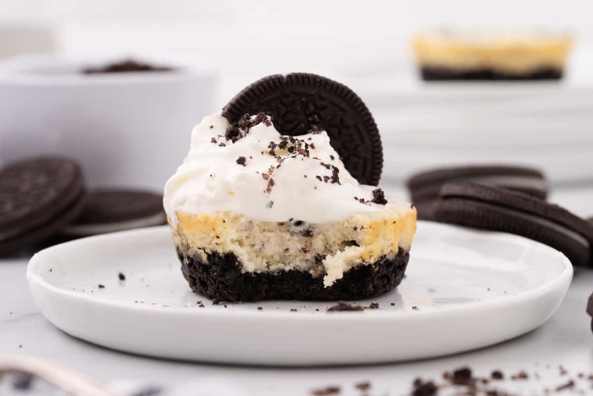 cookies and cream cheesecake bitten on a plate